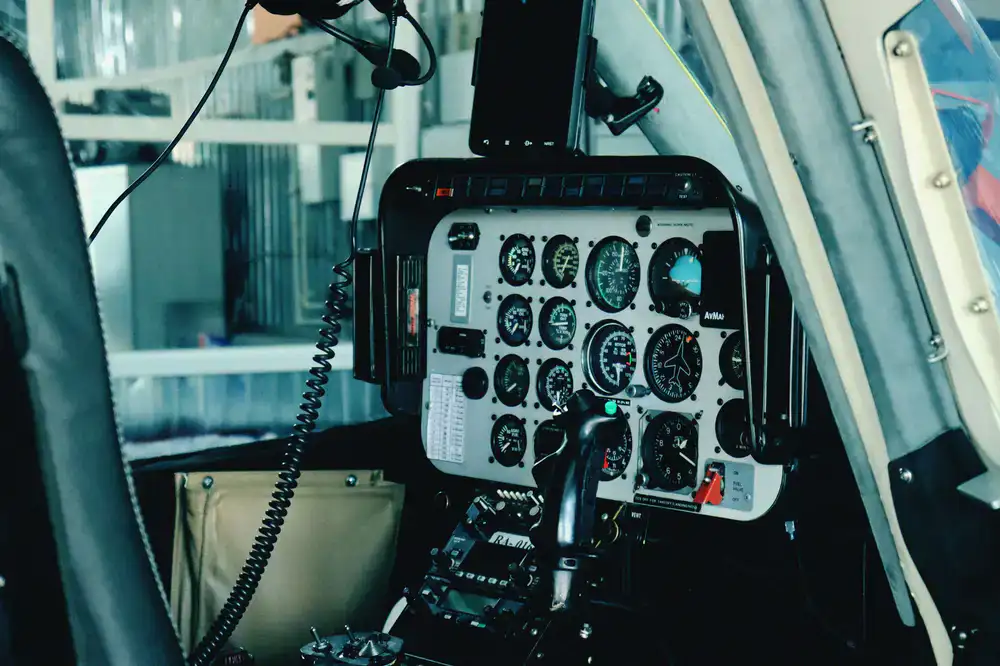 Close-up view of helicopter cyclic and collective controls