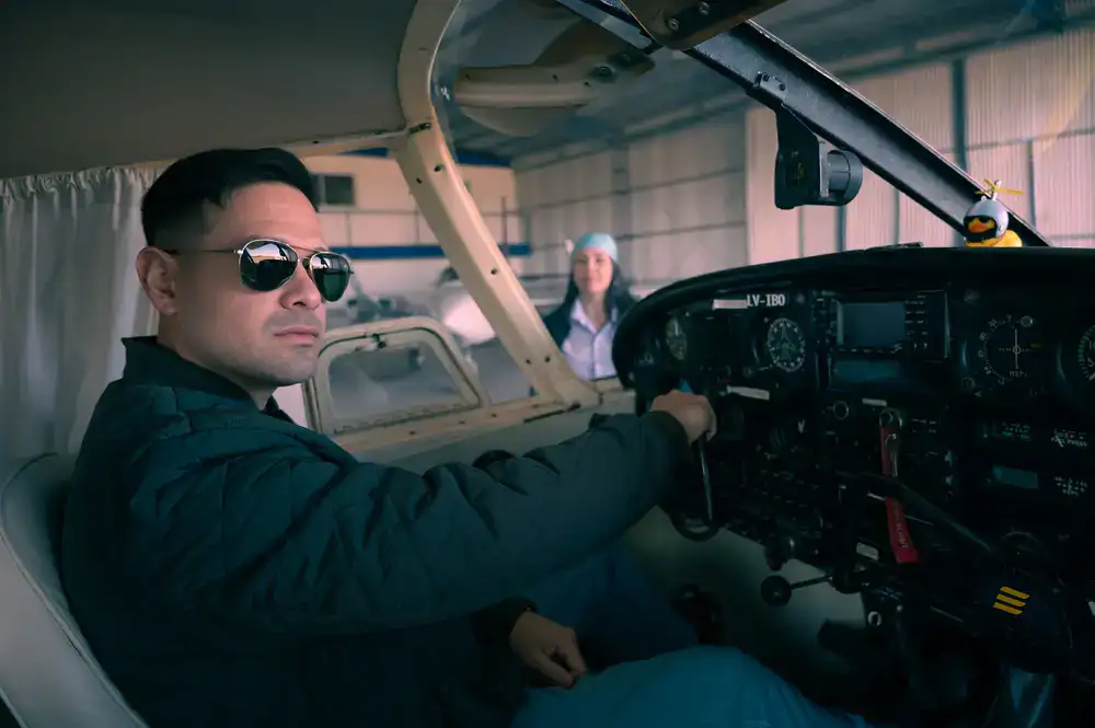 Instructor pointing at flight controls during a briefing